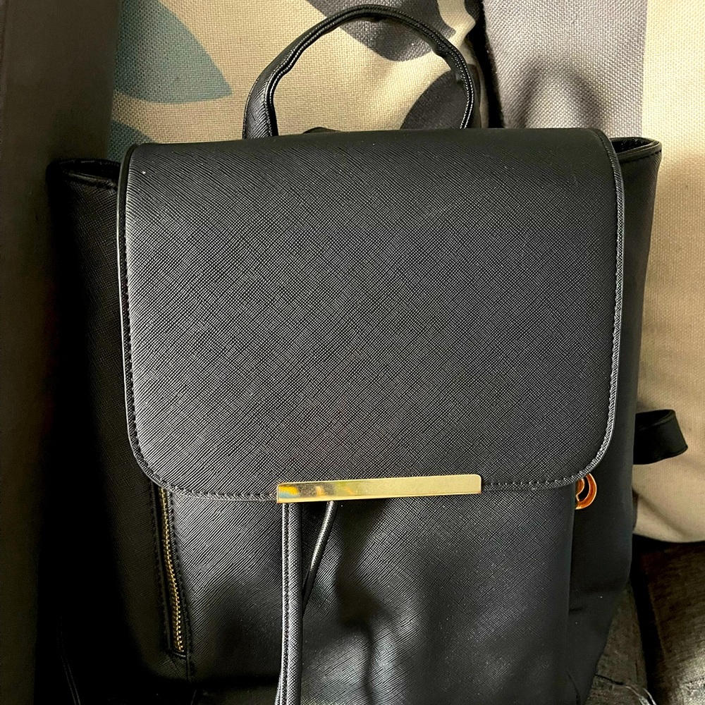 Black backpack with open up zipper